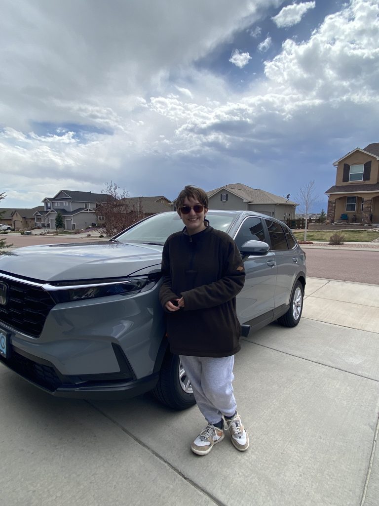 Image of Me, Shealeigh Musgrave, standing next to my car.